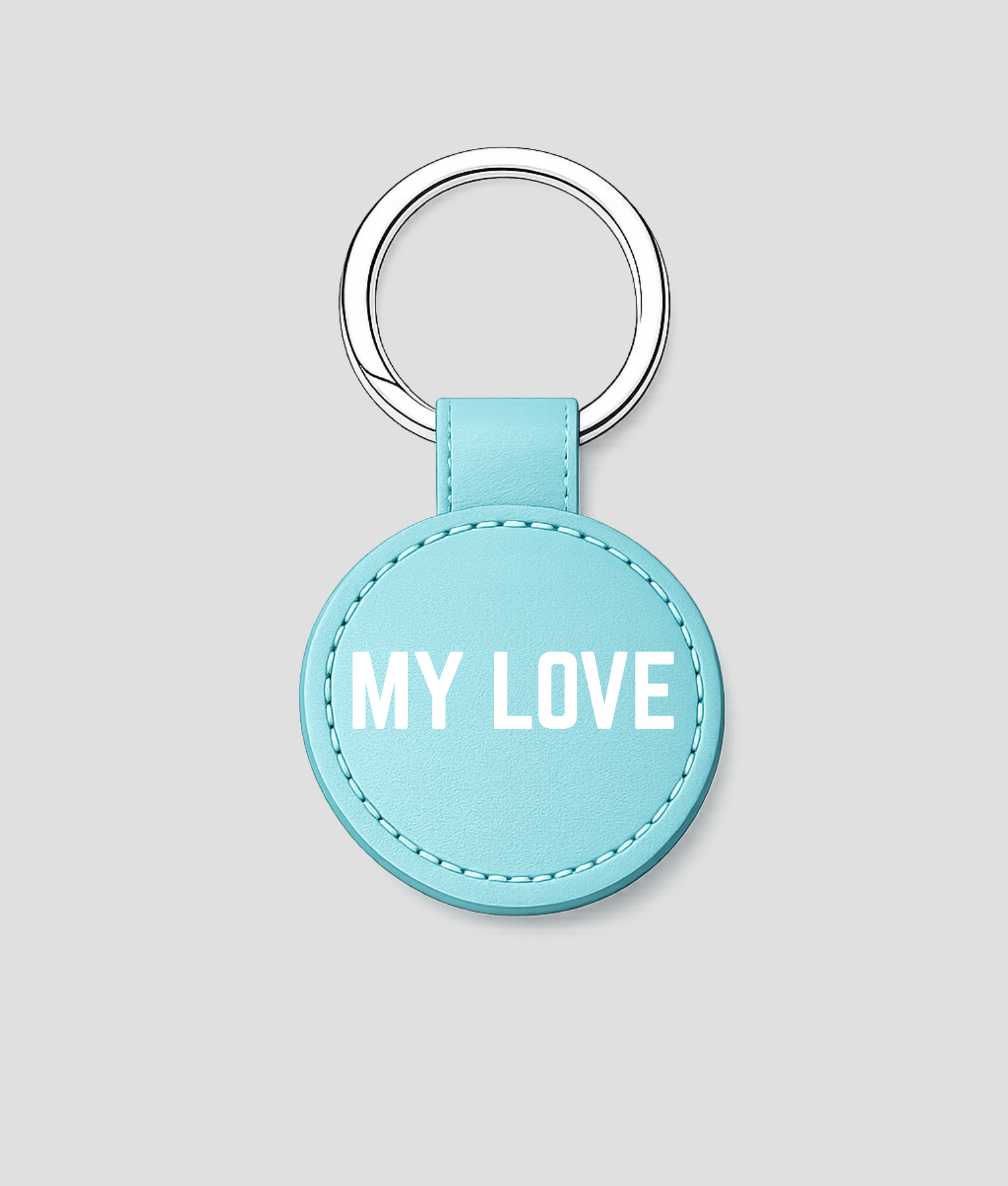 Turquoise ronde leren sleutelhanger met zilveren ring en tekst 'BESTE JUF'