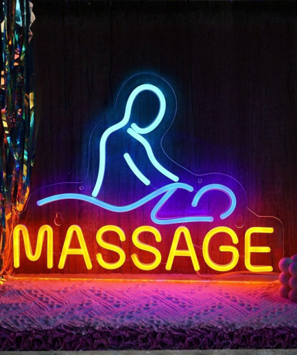 Massage neon lamp, een figuur op een massagetafel met de tekst Massage in blauw en geel
