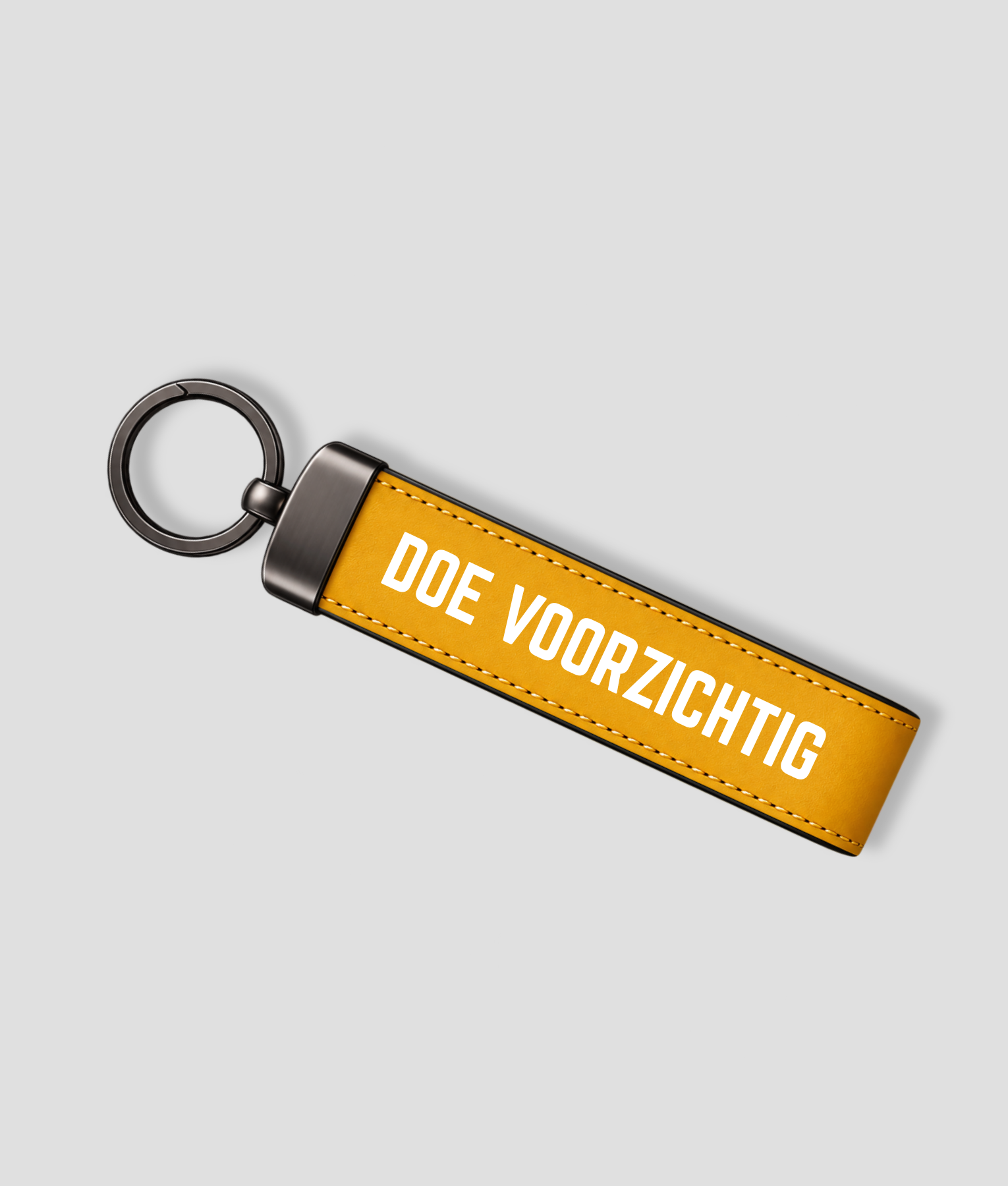 Gele luxe sleutelhanger met de tekst Doe voorzichtig