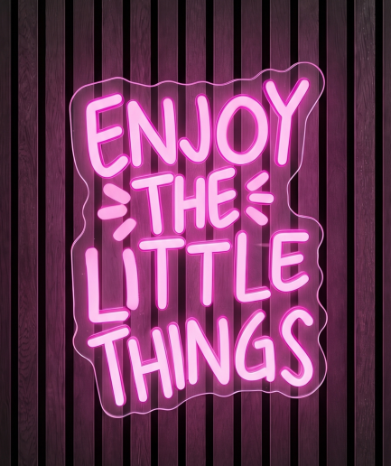 Enjoy the little things neon lamp met de tekst Enjoy the little things in roze licht