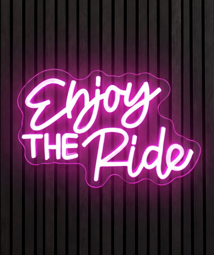 Enjoy the ride neon lamp met de tekst Enjoy the ride in roze en paars licht
