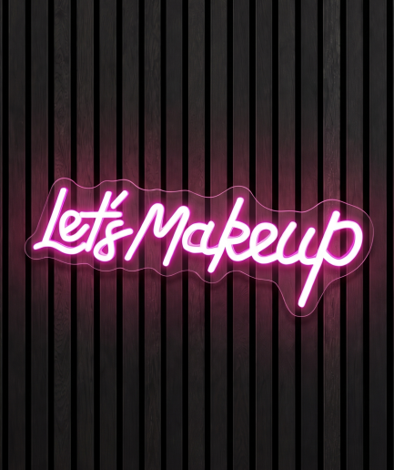 Lets makeup neon lamp met de tekst Lets makeup in roze licht